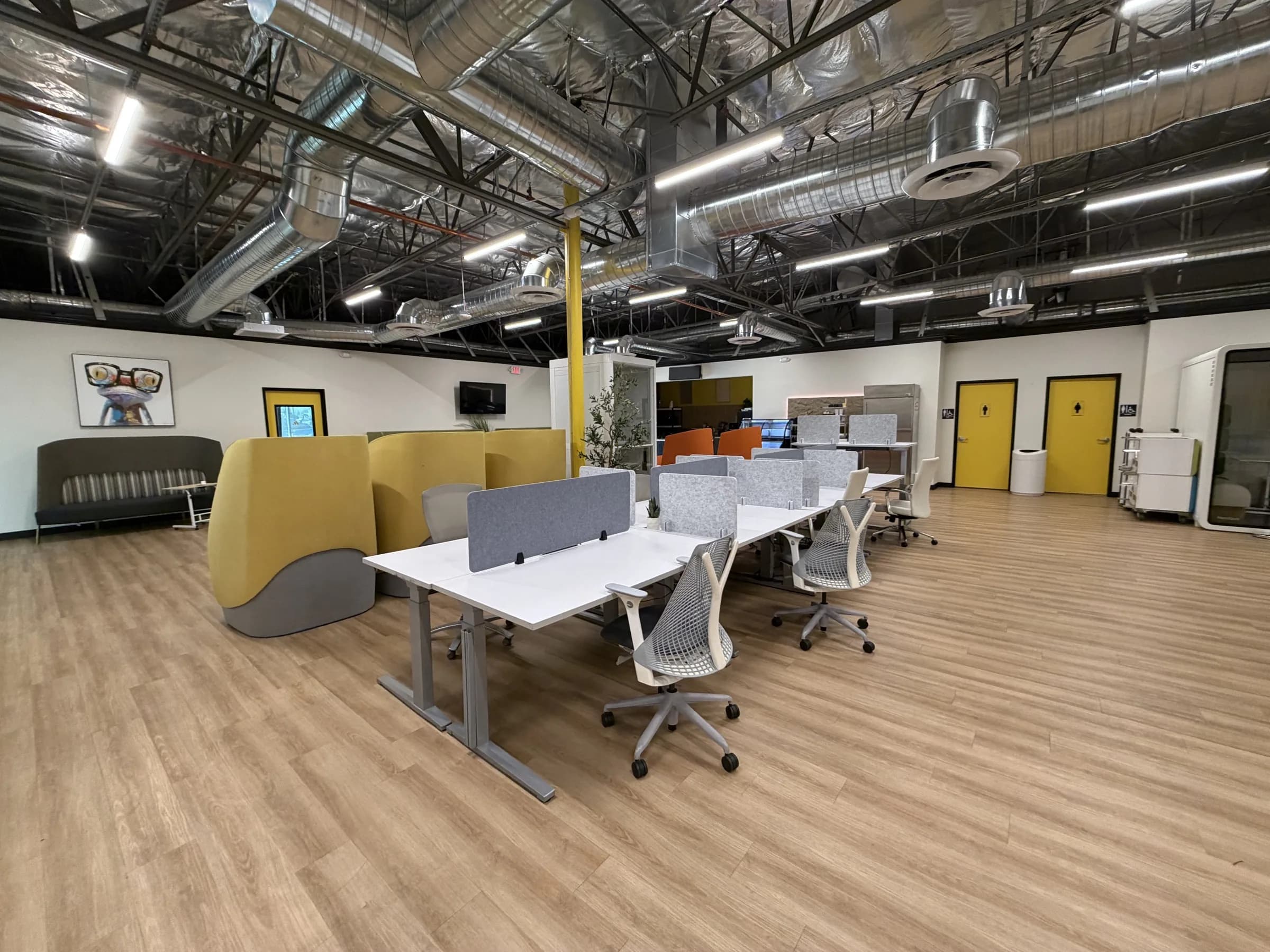 Shared coworking desks and ergonomic chairs at Muze Office Las Vegas