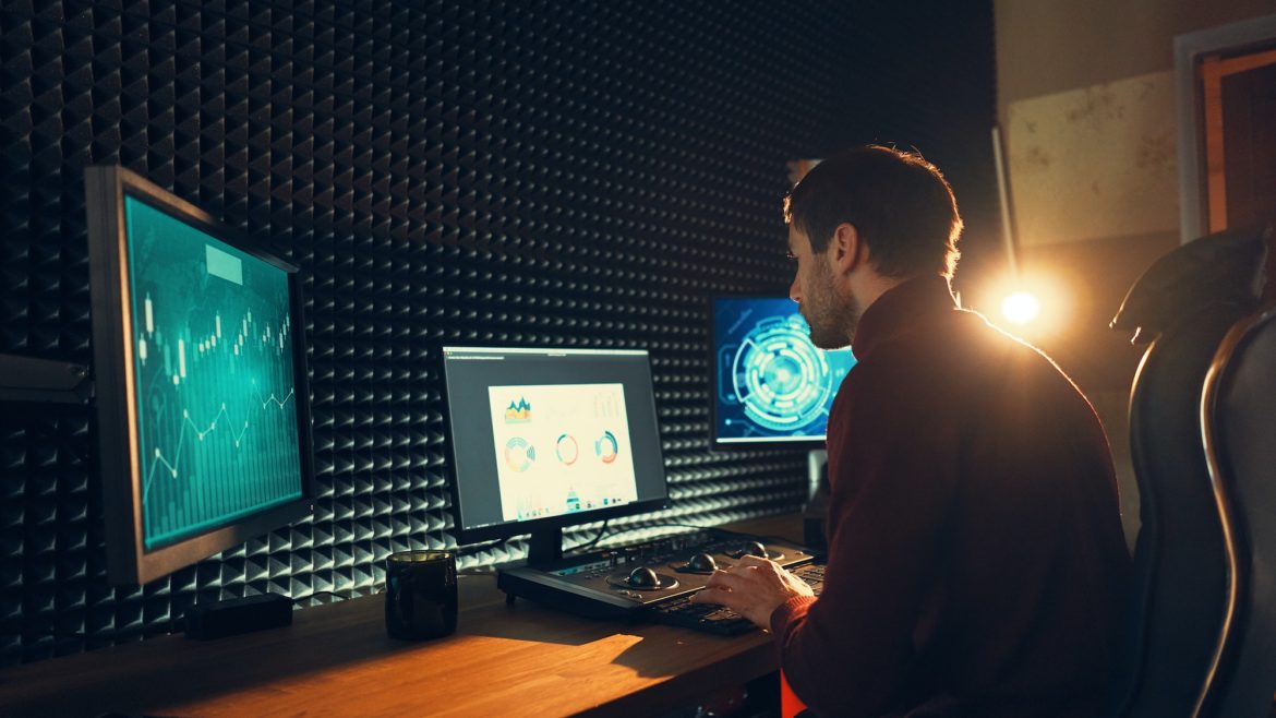 Male Videographer Edits and Cuts Footage and Sound on His Personal Computer