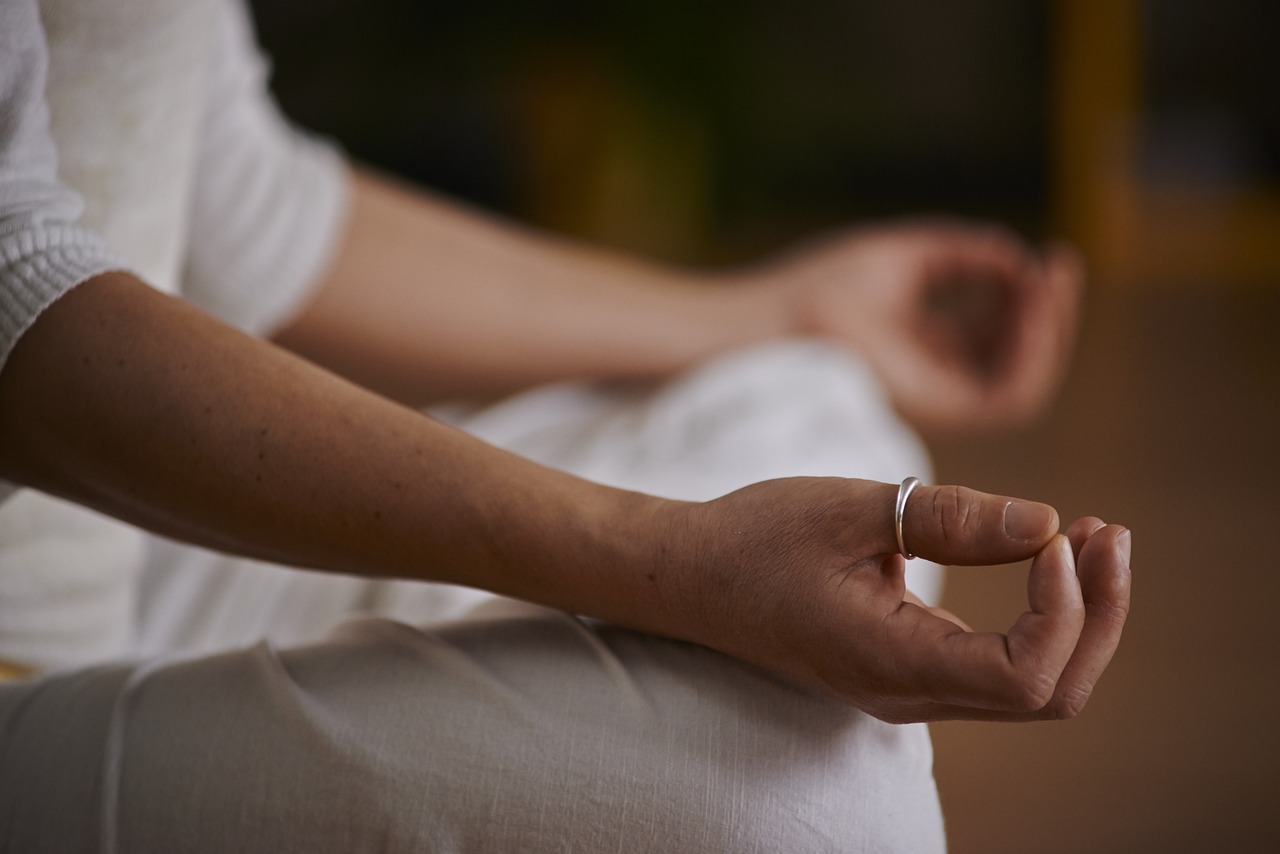 Someone practicing meditation in their home